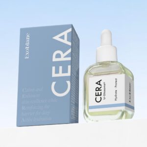 box and bottle of "Cera" skincare product, with the box featuring a light blue design and text about calming and enhancing skin resilience, while the bottle has a white dropper top and a label indicating "Hydra-Protect." The background is a gradient sky blue.