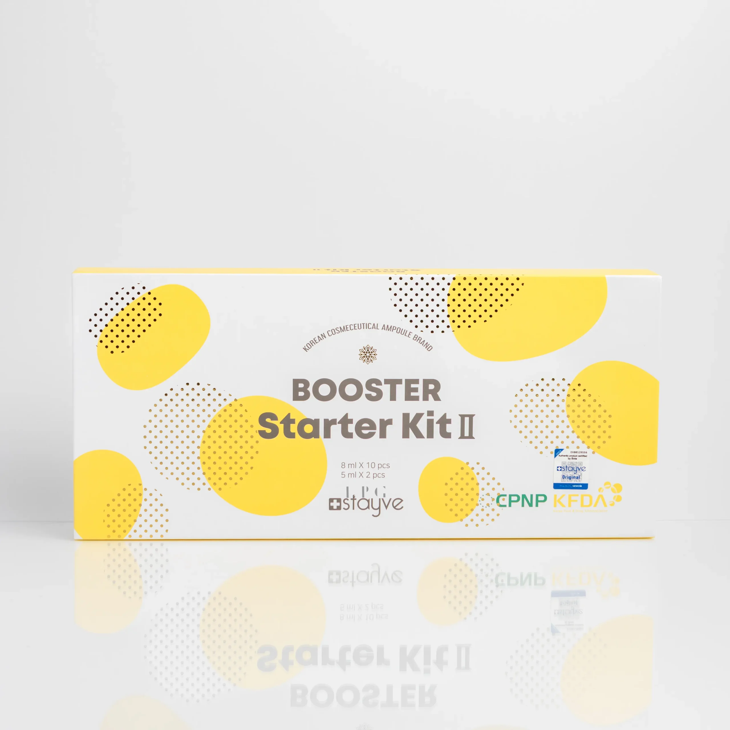 White packaging of "BOOSTER Starter Kit II" with yellow dots, listing contents and certifications on the front.